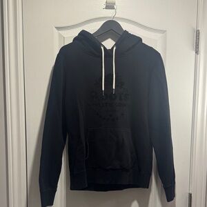 black Roots Canada hoodie with a raised "Beaver" logo